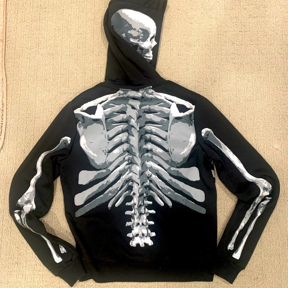 Black full-zip hoodie with skeleton graphic front/back/hood. Fleece lining.